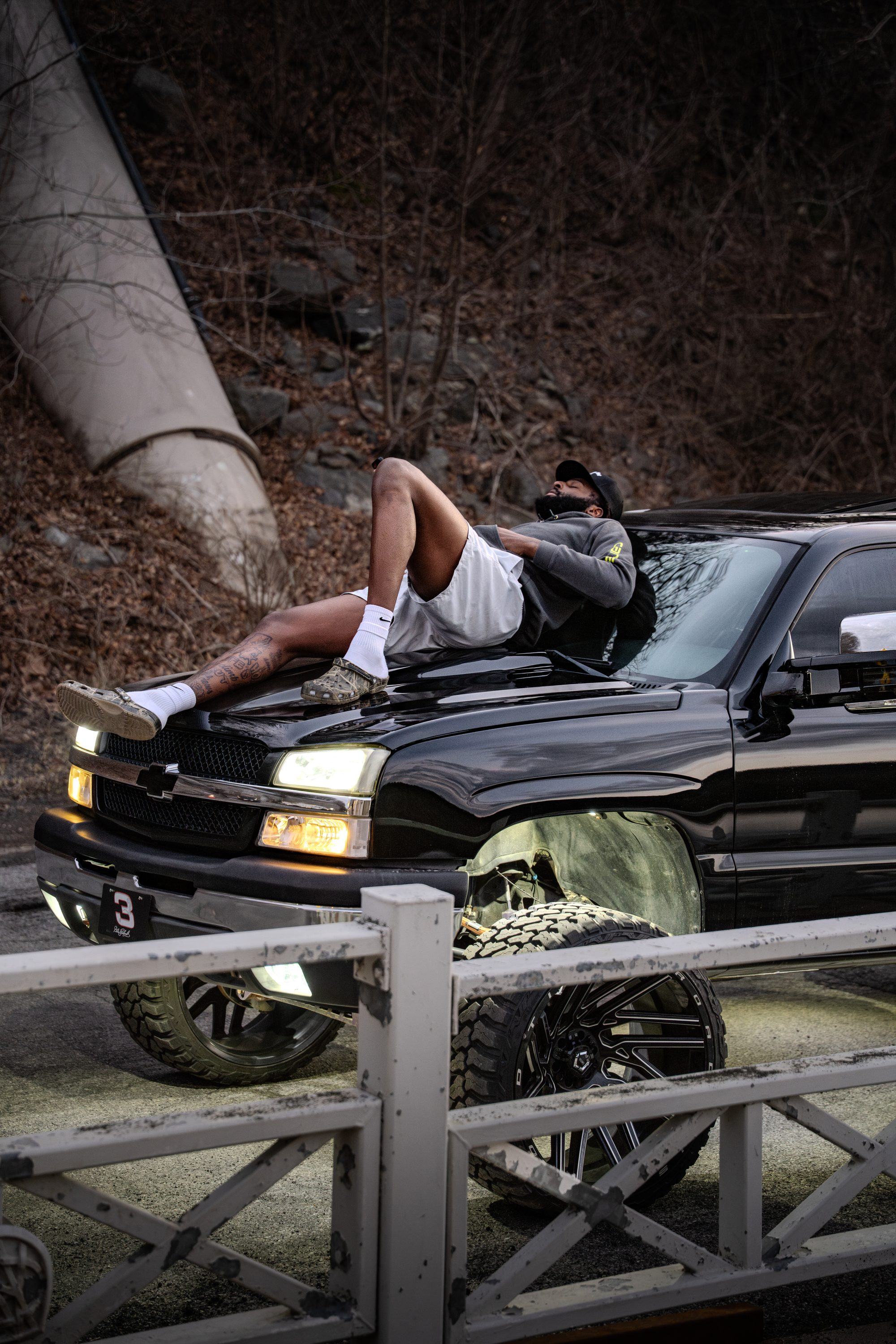 Cat Eye truck against a white fence